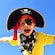 A young boy wearing a pirate hat, an eyepatch and a skull and crossbones bandanna